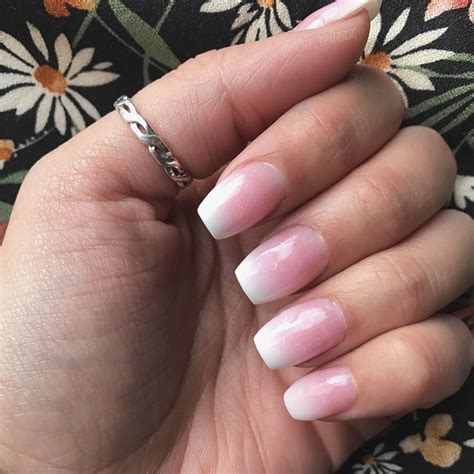 For those of you that love the idea of a grown-up glitter manicure but still want to keep it neutral, this subtle shimmer will be your best bet. . Pink and white ombre nails